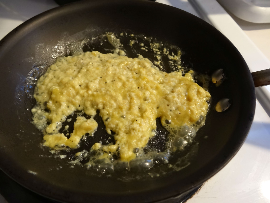 Vegan scrambled eggs cooking.